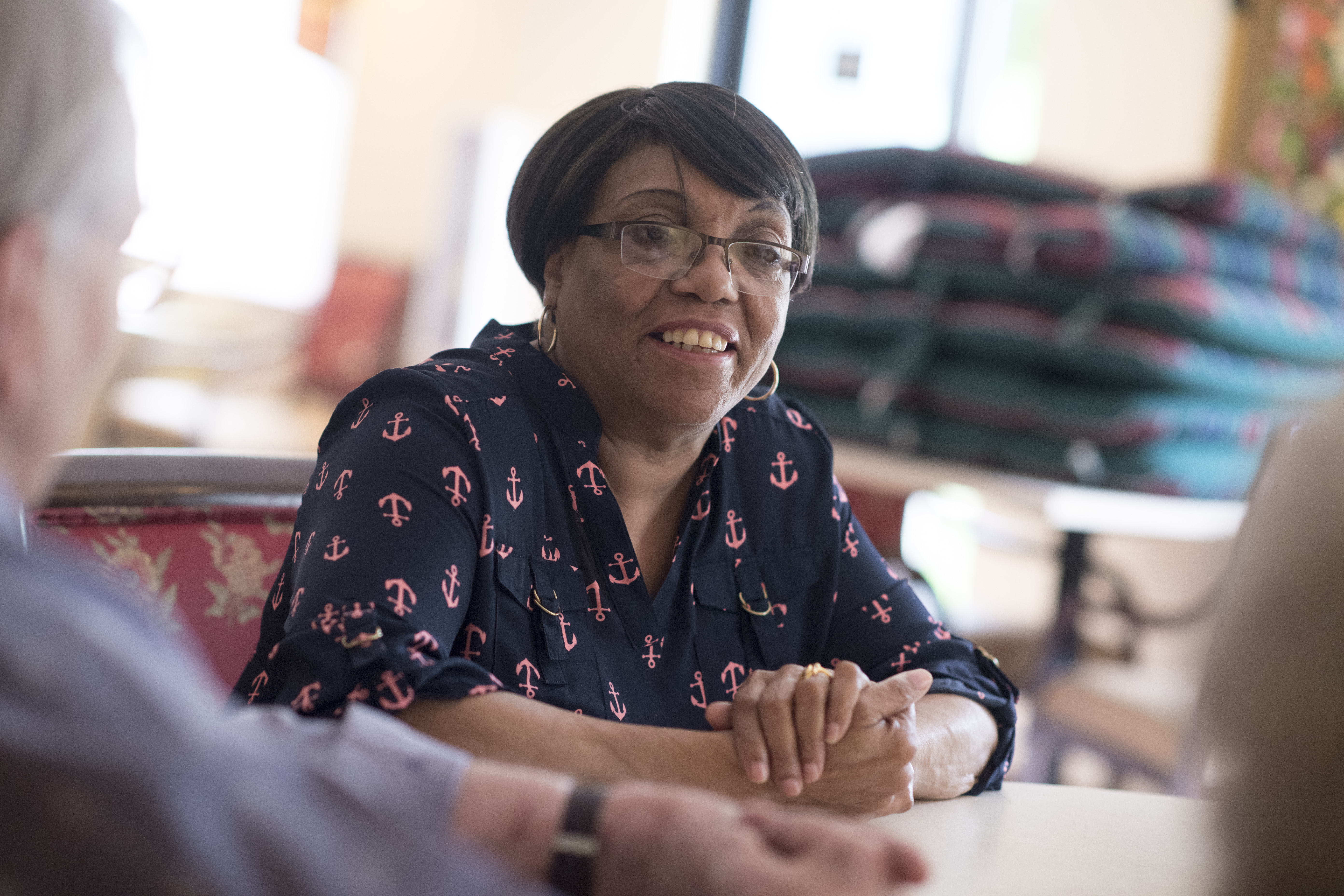 Woman in glasses smiling close up