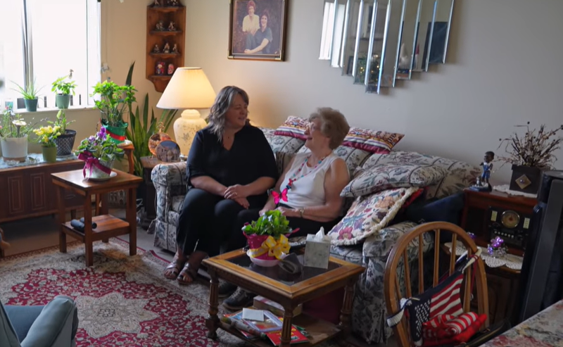 Two people sitting on a couch