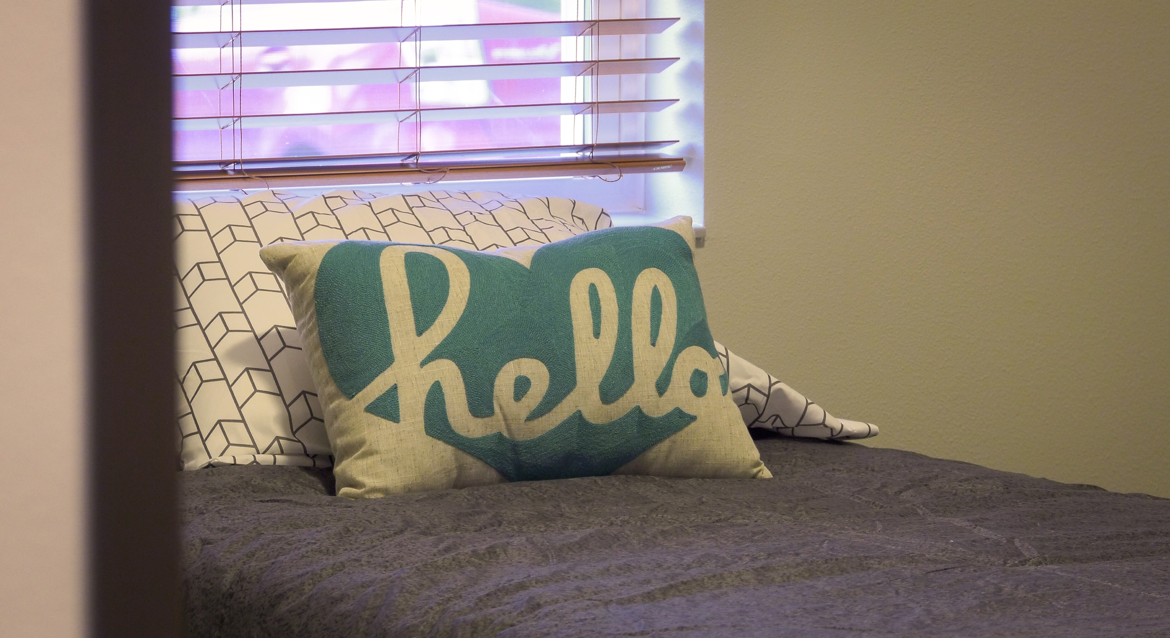 Bed_with_Hello_pillow